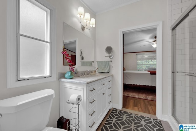 ensuite bathroom featuring a tile shower, connected bathroom, vanity, and crown molding