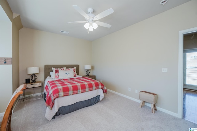 bedroom with a ceiling fan, carpet, visible vents, and baseboards