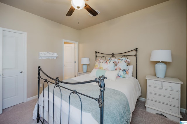 carpeted bedroom featuring a ceiling fan and baseboards