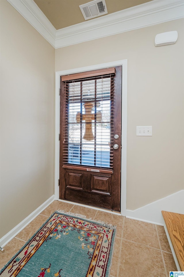 entryway featuring tile patterned flooring, visible vents, baseboards, and ornamental molding