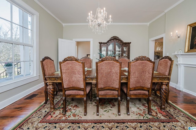 dining space with a healthy amount of sunlight, an inviting chandelier, and crown molding