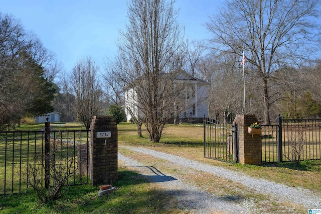 view of gate featuring fence