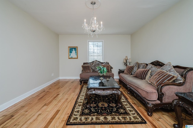 living area featuring light wood finished floors and baseboards