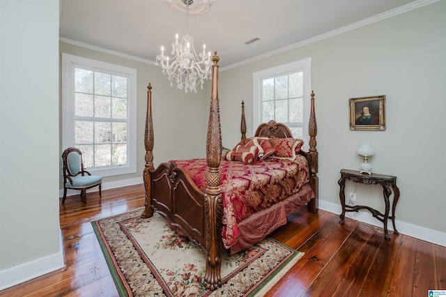 bedroom with crown molding, visible vents, baseboards, wood-type flooring, and an inviting chandelier