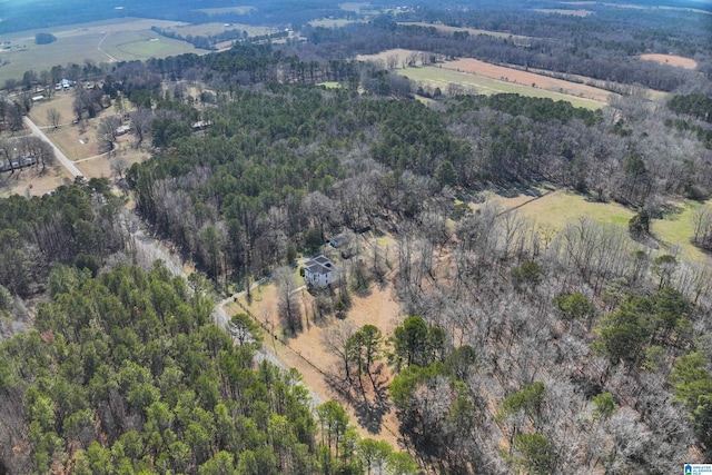 aerial view featuring a forest view and a rural view