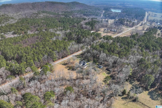 aerial view featuring a wooded view