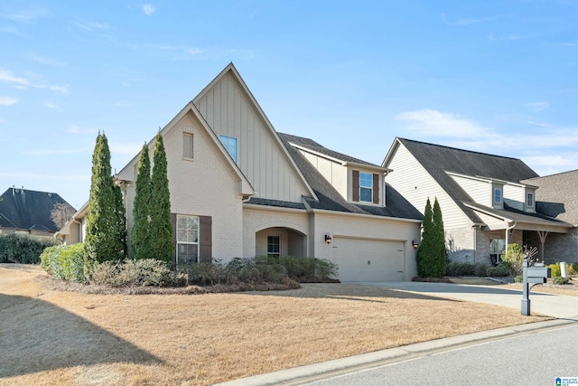 view of front of home with a garage, brick siding, driveway, roof with shingles, and board and batten siding