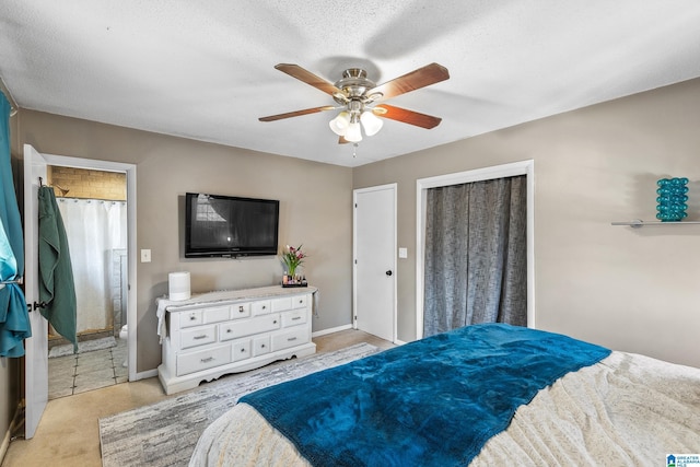 bedroom featuring a textured ceiling, a ceiling fan, and baseboards