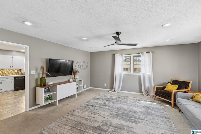 sitting room with a ceiling fan, recessed lighting, light colored carpet, and baseboards