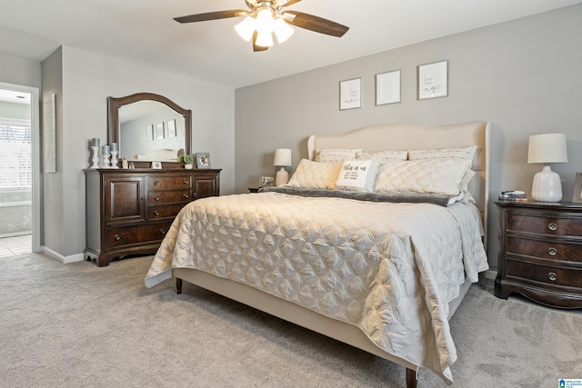 carpeted bedroom with baseboards and a ceiling fan