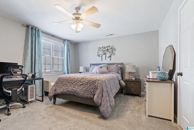 bedroom featuring light carpet, ceiling fan, and visible vents