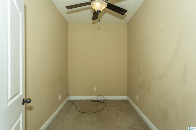 unfurnished room with ceiling fan, baseboards, and carpet