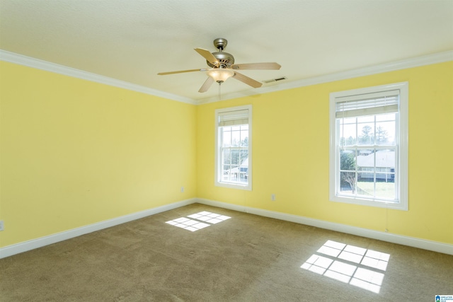 unfurnished room with carpet flooring, baseboards, ceiling fan, and crown molding