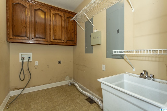 laundry area featuring washer hookup, a sink, light floors, cabinet space, and hookup for an electric dryer