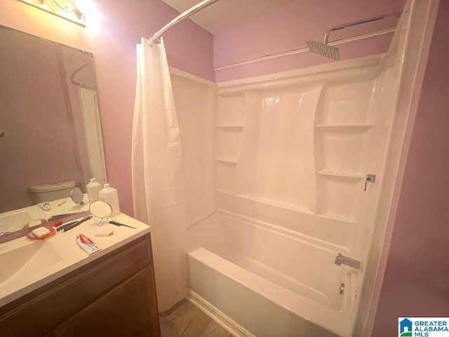 bathroom featuring shower / bathtub combination with curtain and vanity