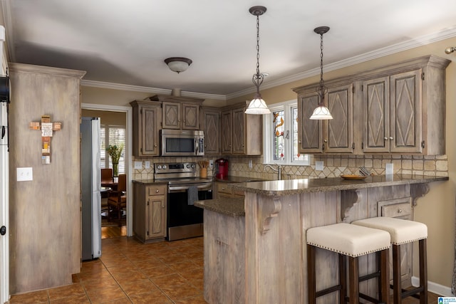 kitchen featuring decorative backsplash, appliances with stainless steel finishes, a kitchen breakfast bar, and a wealth of natural light