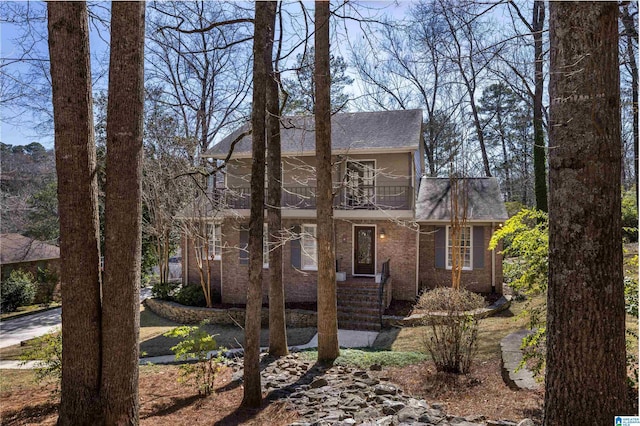 view of front of property with a balcony