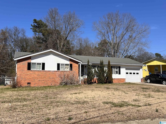 view of front of property featuring a garage, a front yard, crawl space, and brick siding