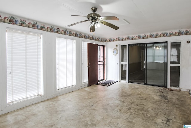 interior space with ceiling fan and tile patterned floors