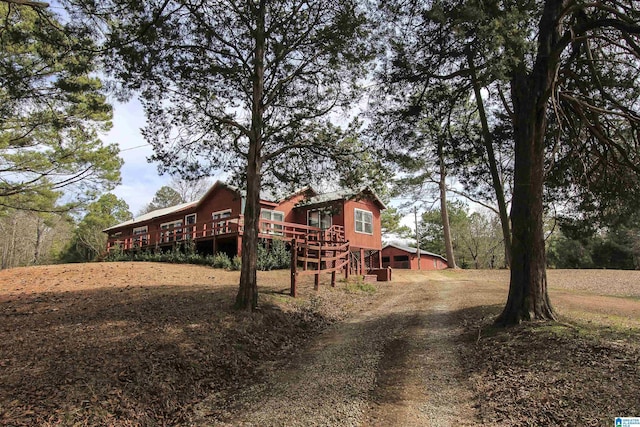 exterior space featuring stairway and a deck