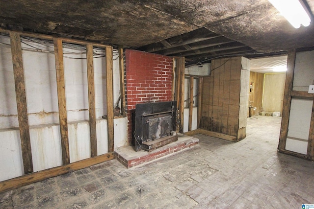 unfinished basement with a wood stove