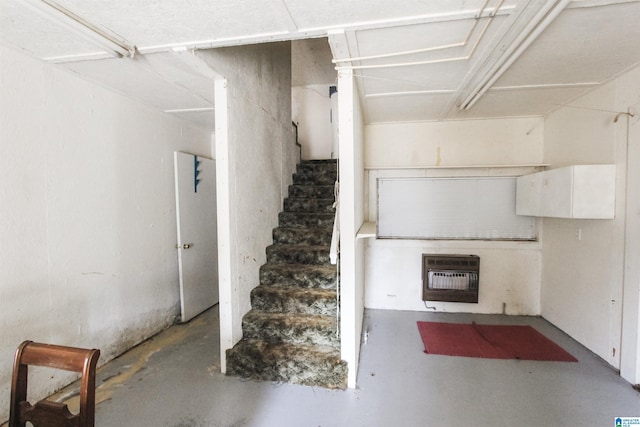 stairway with heating unit and concrete flooring