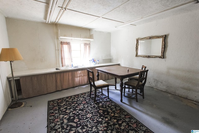 dining area with concrete floors