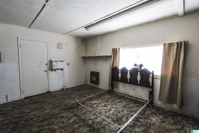 washroom featuring a wall mounted air conditioner and heating unit