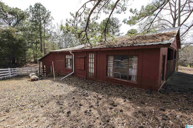 exterior space featuring fence and board and batten siding