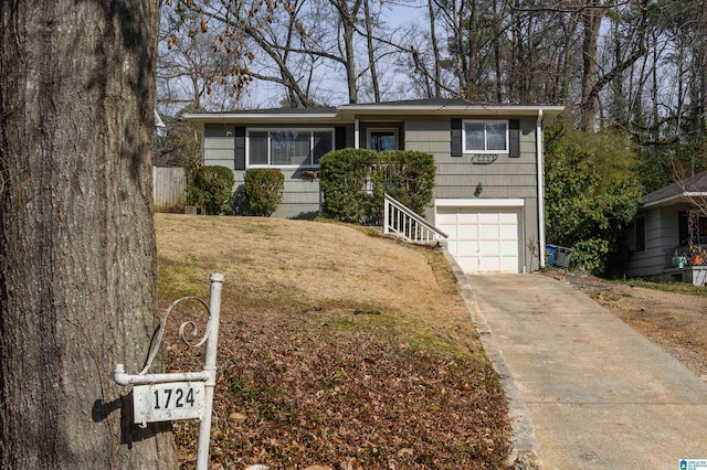 view of front of property featuring an attached garage and concrete driveway