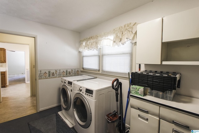 clothes washing area featuring laundry area and separate washer and dryer