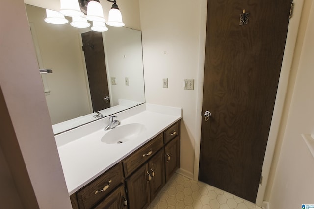 bathroom with tile patterned flooring and vanity