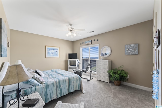 bedroom with carpet floors, visible vents, ceiling fan, and baseboards