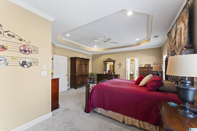 bedroom featuring ornamental molding, a raised ceiling, and light colored carpet