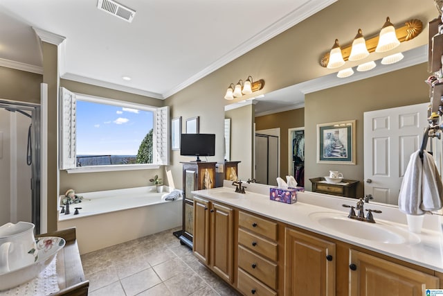 full bathroom with visible vents, a sink, a shower stall, and tile patterned floors