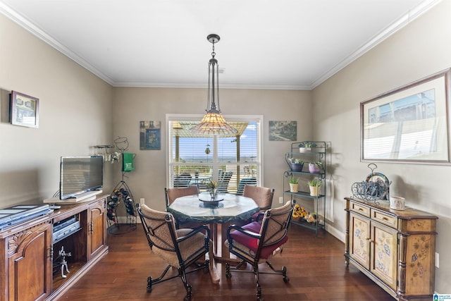 dining area with ornamental molding, dark wood-style flooring, and baseboards