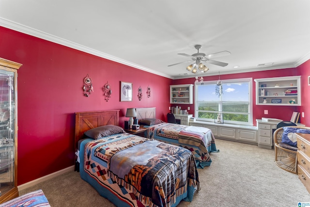 carpeted bedroom with a ceiling fan, baseboards, visible vents, and crown molding