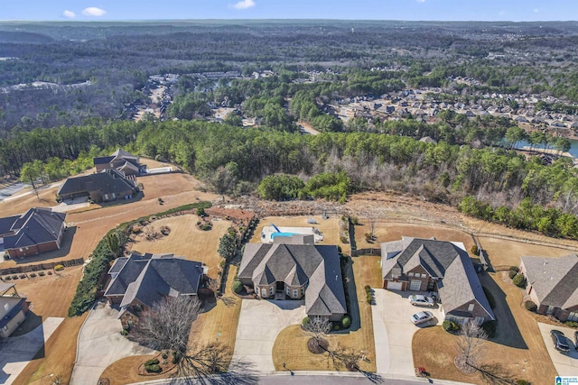 drone / aerial view with a view of trees