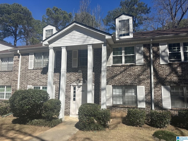 view of front of home with brick siding