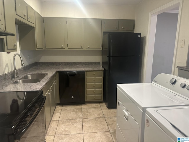 kitchen with light tile patterned floors, gray cabinetry, a sink, black appliances, and washing machine and clothes dryer