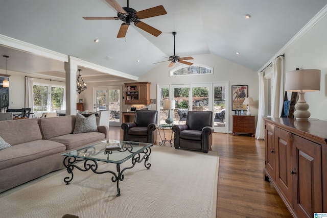 living area featuring a notable chandelier, crown molding, high vaulted ceiling, and dark wood-style flooring