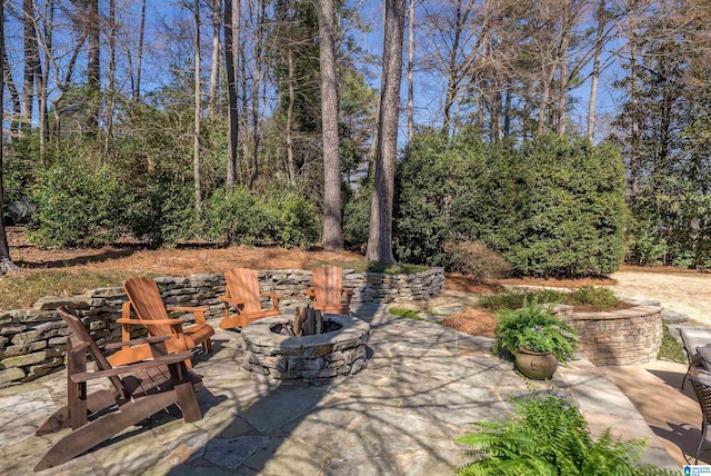 view of patio / terrace with an outdoor fire pit