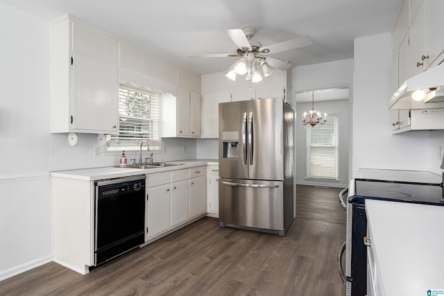 kitchen with stainless steel appliances, dark wood-type flooring, a sink, and white cabinetry