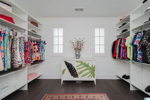 walk in closet featuring visible vents and wood finished floors