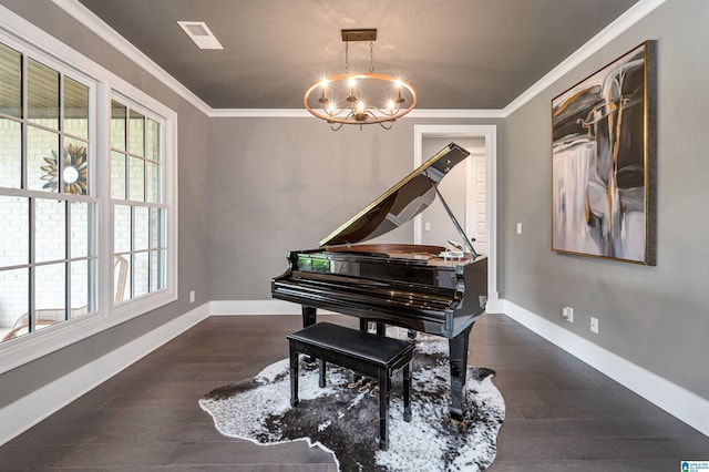 living area featuring ornamental molding, visible vents, an inviting chandelier, and wood finished floors