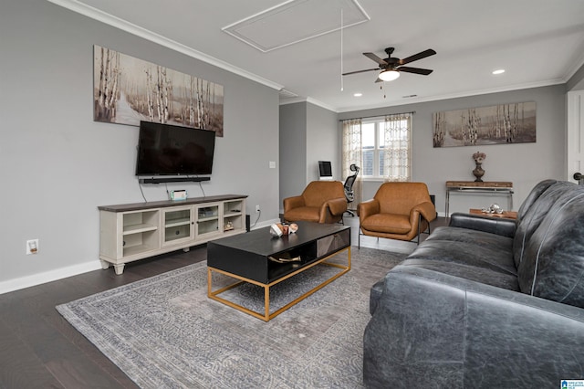 living area with recessed lighting, wood finished floors, baseboards, ornamental molding, and attic access