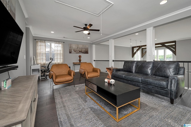 living room with dark wood-style floors, ornamental molding, attic access, and recessed lighting