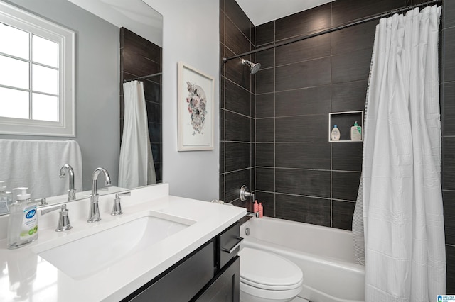 bathroom featuring vanity, toilet, and shower / bath combo with shower curtain