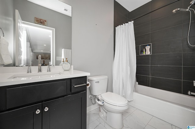 bathroom featuring marble finish floor, shower / tub combo, vanity, and toilet