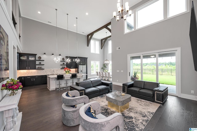 living area featuring a chandelier, recessed lighting, dark wood finished floors, and baseboards